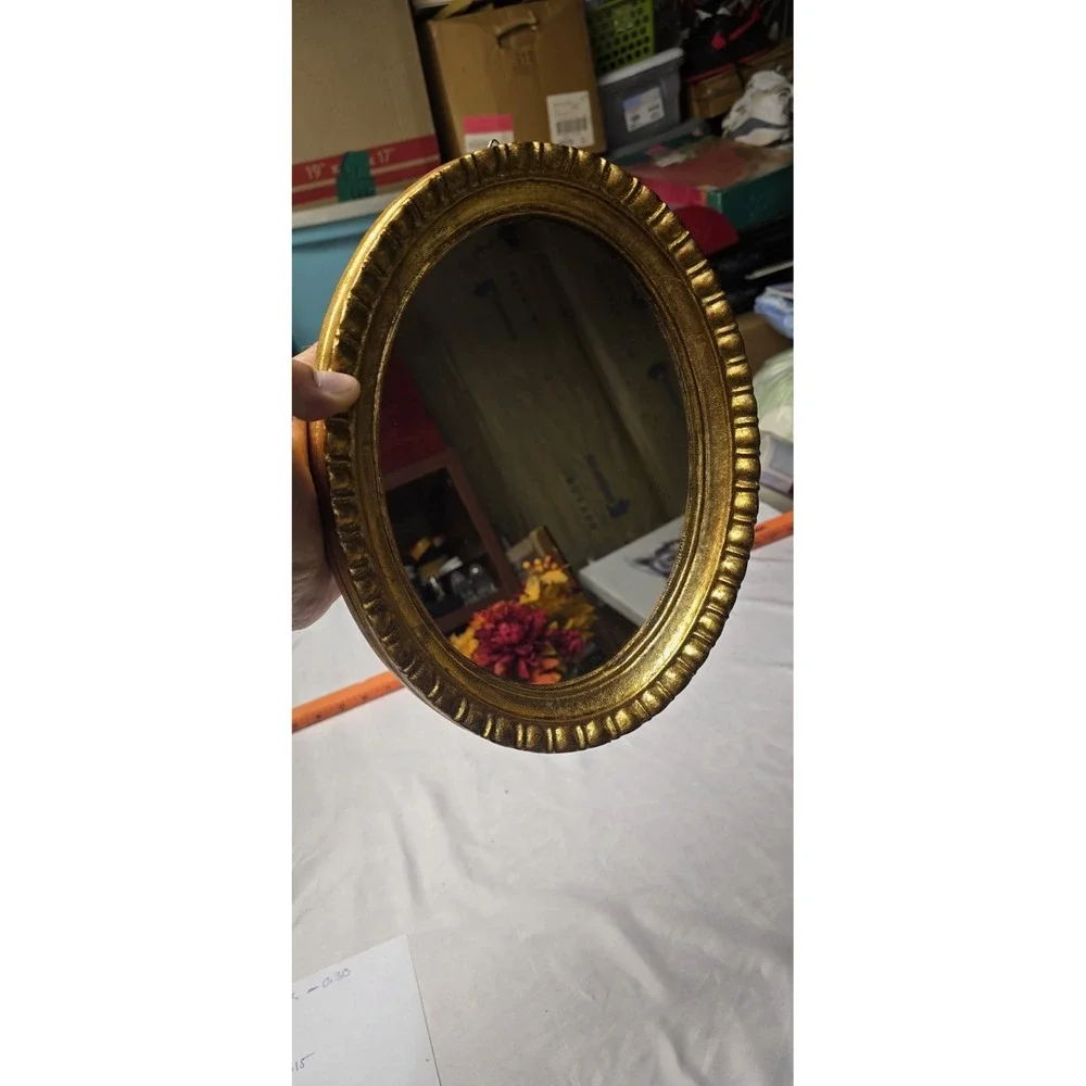 Vintage Or Antique Oval Wall Mirror with An Ornate Gold Gilt Frame